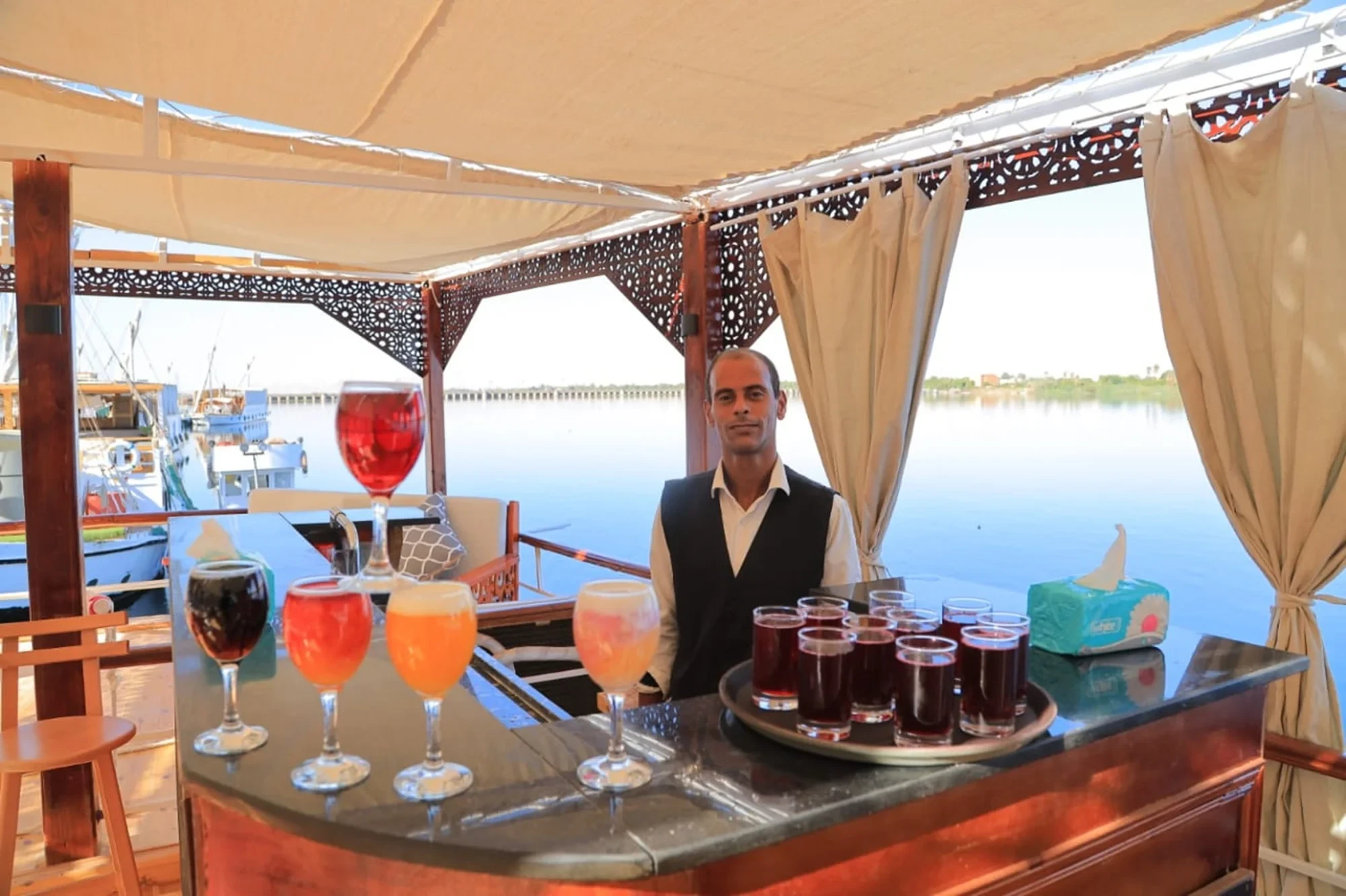 Elegant bar onboard the Queen Nefer Dahabiya Cruise