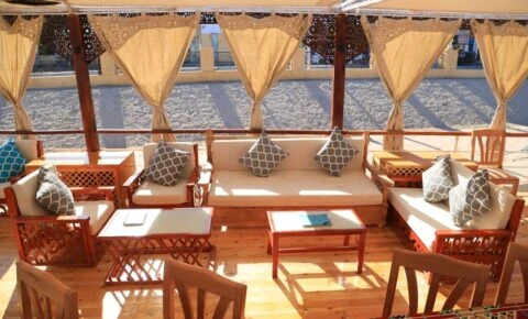 Outdoor dining experience on the Queen Nefer Dahabiya Cruise